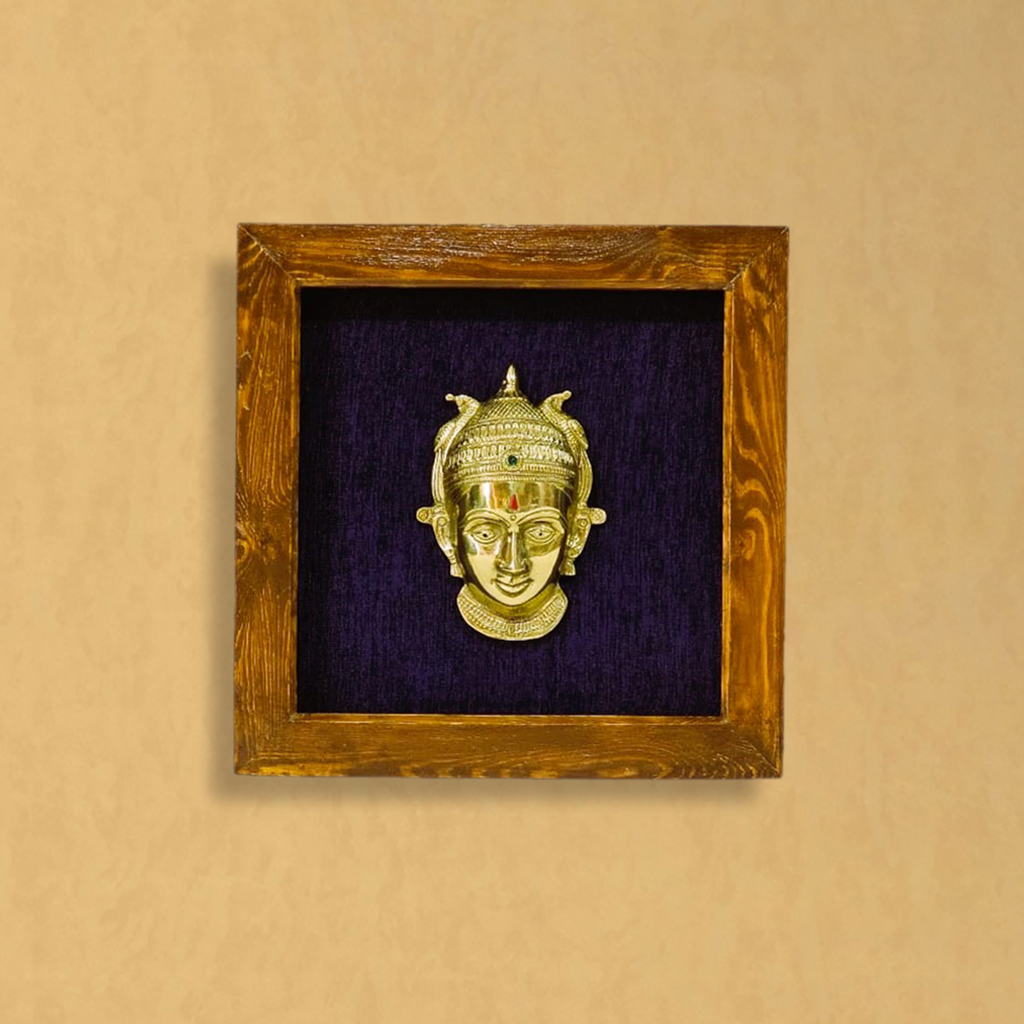Female figurine in a wooden frame