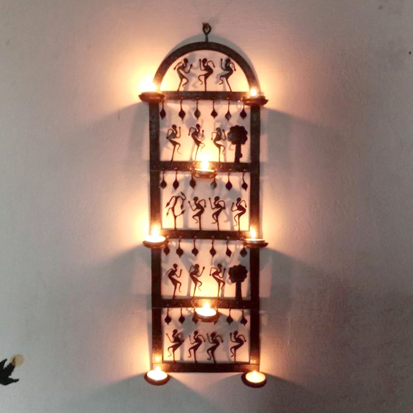 Wrought Iron Tribal Wall Hanging Tea Light Holder: Artistic Illumination for Your Home