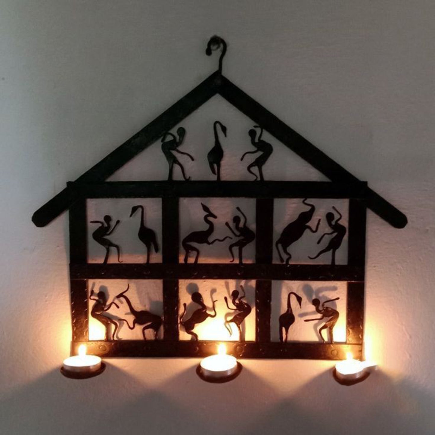 Wrought Iron Tribal Tea Light Holder Wall Hanging: Fusion of Artistry and Functionality