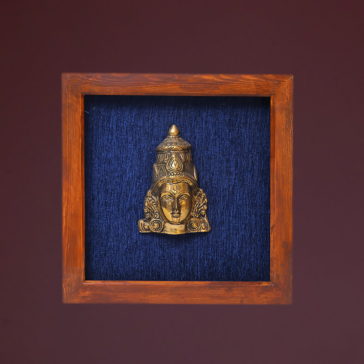 Female Figurine Face in Wooden Frame
