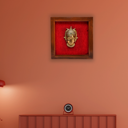 Female figurine in a wooden frame