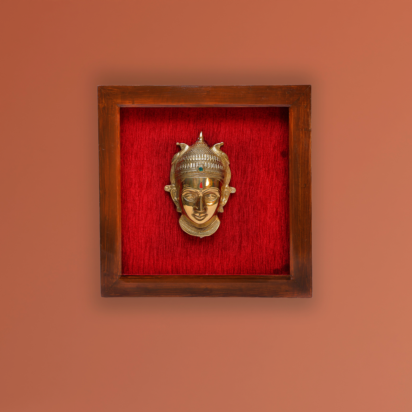 Female figurine in a wooden frame