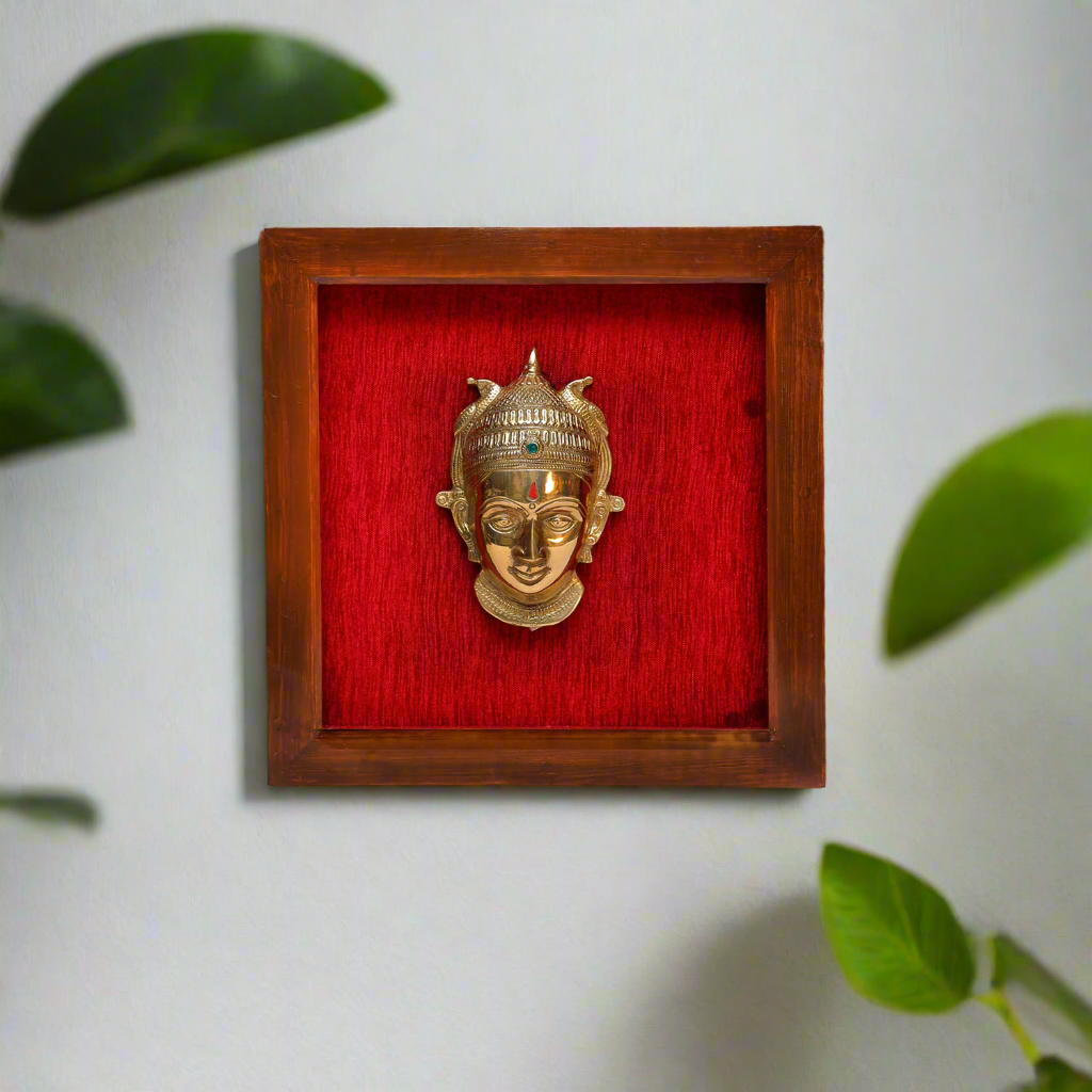 Female figurine in a wooden frame