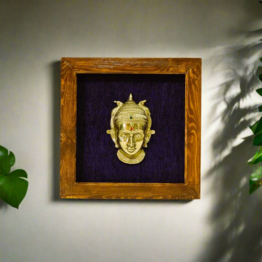 Female figurine in a wooden frame