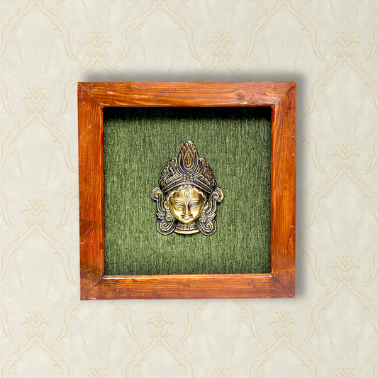 Ma Durga Face Art in Brass, Captured in a Wooden Frame with Green Background
