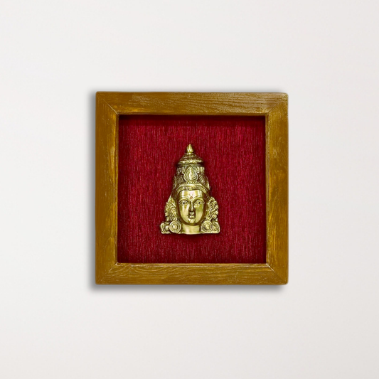 Female figurine in a wooden frame